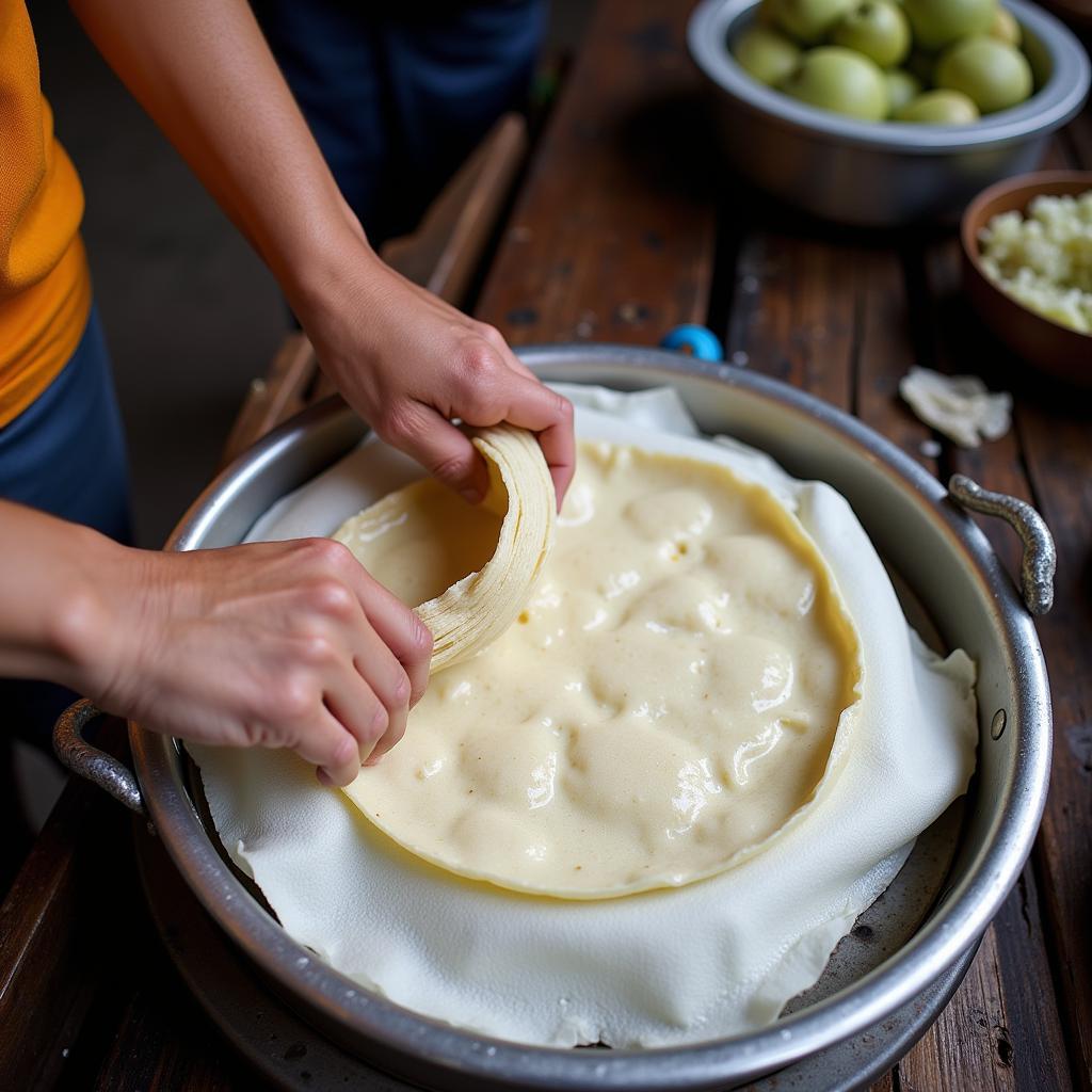 Skilled Hands Making Banh Cuon Giai Phong