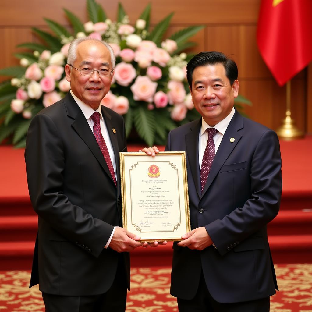 Legendary Vietnamese footballer Lê Huỳnh Đức receiving a national award