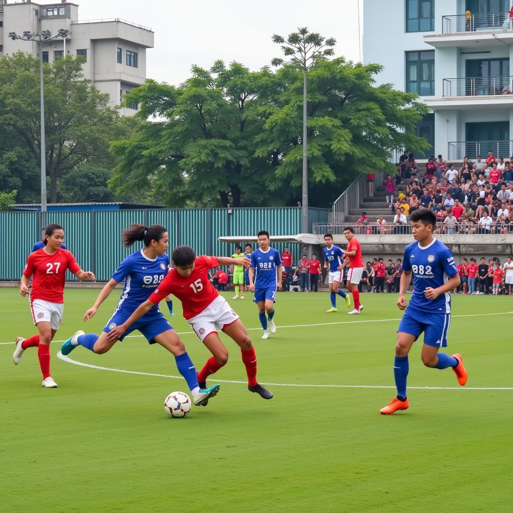 Hình ảnh một trận đấu sôi nổi diễn ra trên sân bóng 24 Giải Phóng, thu hút đông đảo khán giả đến cổ vũ